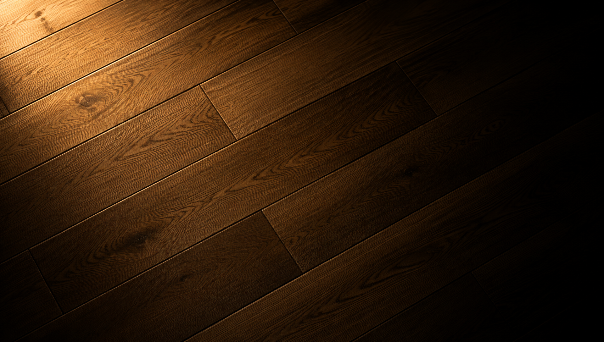Top view of engineered oak planks in staggered rows under raking light